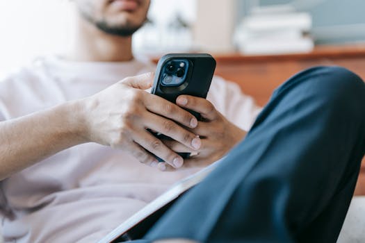 man using a nutrition app on his phone