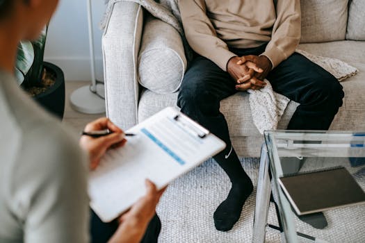 man discussing supplements with doctor